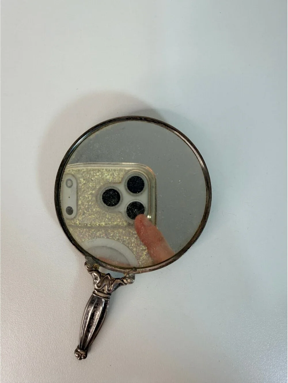 Vintage antique silver tone hand mirror with engraved sunburst back